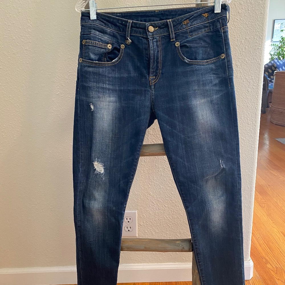 Vintage Blue Skinny Jeans with fading and rips.